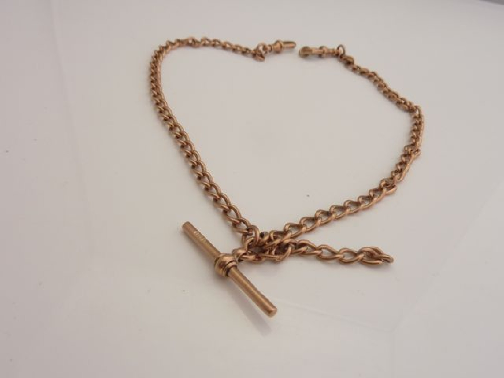 Appraisal: A ct rose gold watch chain with toggle some damage