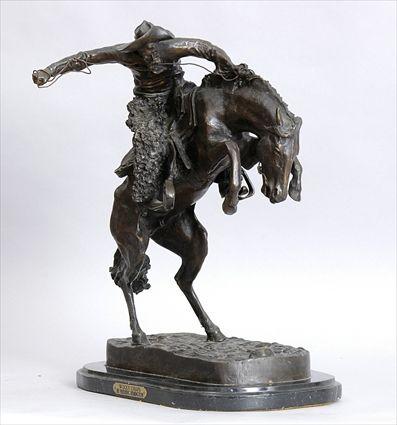 Appraisal: BRONZE EQUESTRIAN GROUP WOOLY CHAPS Modeled as a cowboy on