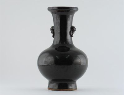 Appraisal: A Chinese ovoid vase with tall flaring neck and lion