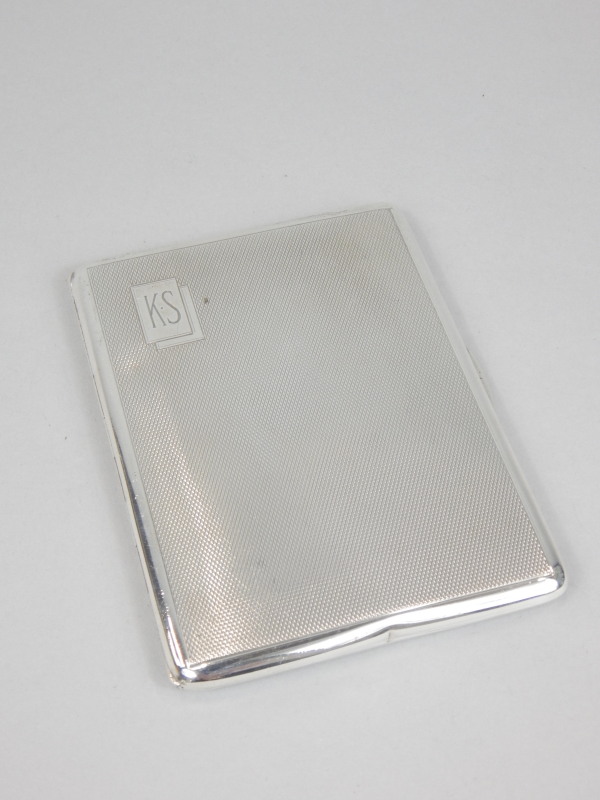 Appraisal: An Art Deco period engine turned silver cigarette case bearing