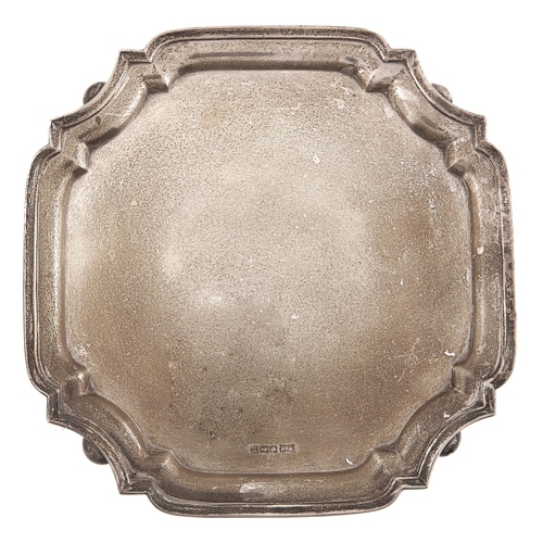 Appraisal: A George V silver waiter shaped square on bun feet