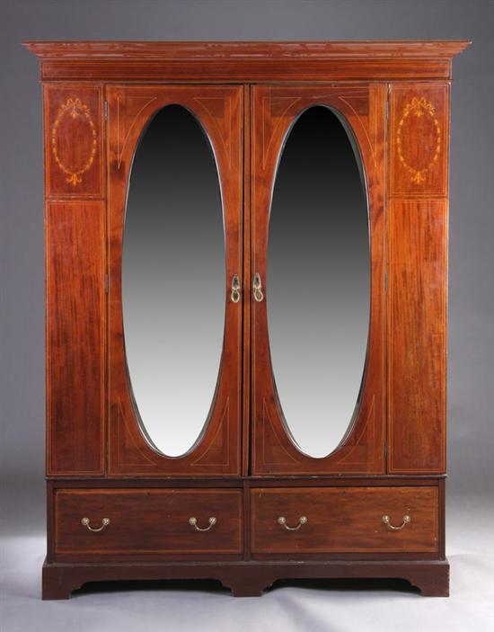 Appraisal: EDWARDIAN NEOCLASSICAL MAHOGANY WARDROBE early th century Stepped molded-edge crown