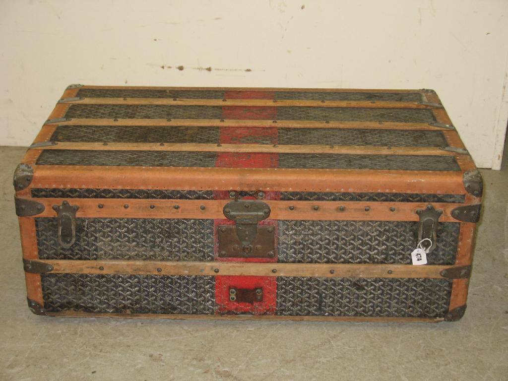 Appraisal: Malles Goyard Paris A large travelling trunk with metal side