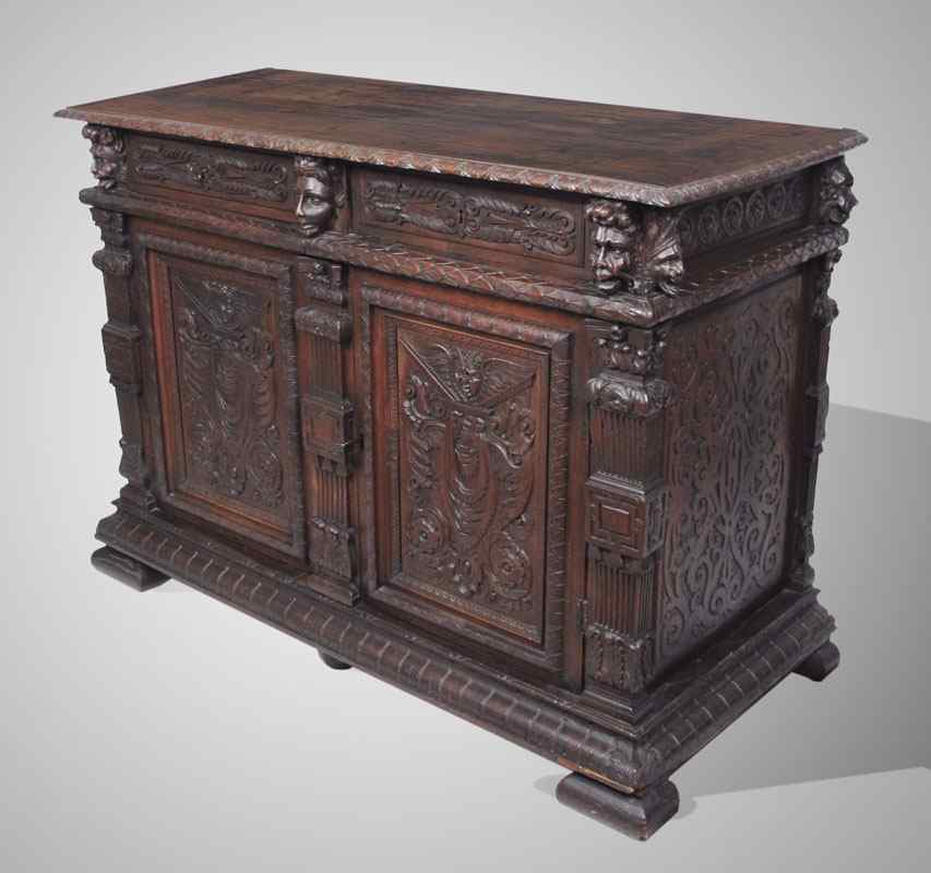 Appraisal: HEAVILY CARVED FIGURAL ITALIAN SIDEBOARD Carved with faces floral and