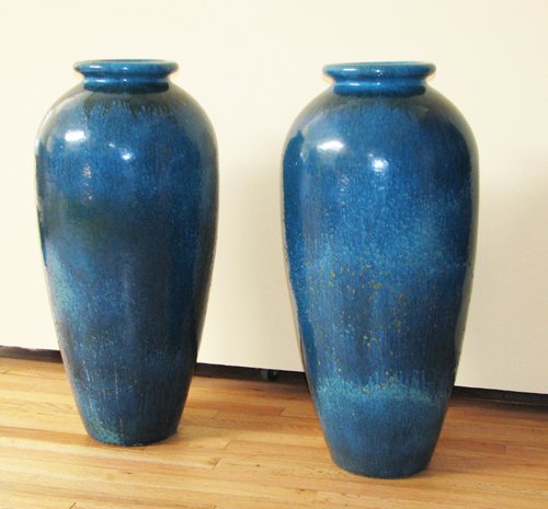 Appraisal: Artist Title Pair of Tall Turquoise Glazed Urns Medium glazed