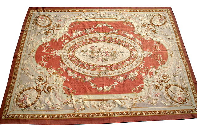 Appraisal: AN 'AUBUSSON' STYLE FORMAL CARPET the central oval foliate medallion