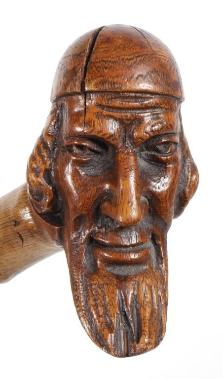 Appraisal: Likely European walking stick with carved head handle Measures long