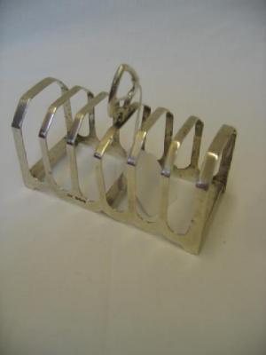 Appraisal: A TOAST RACK of oblong form with seven canted square