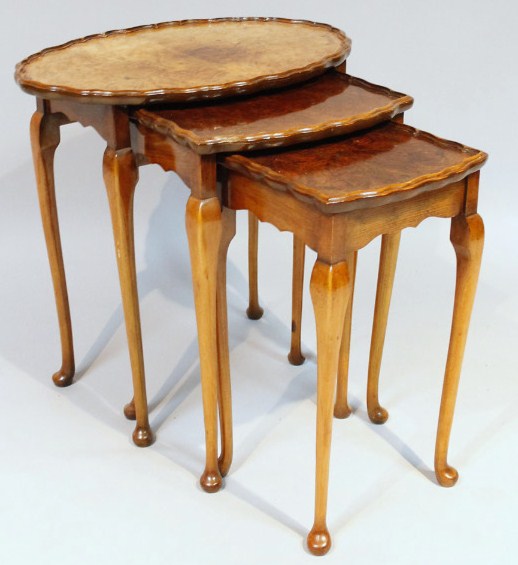 Appraisal: A nest of three 's burr walnut finish tables each