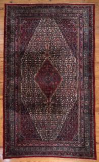 Appraisal: Iranian ' Iranian area rug having an all-over multicolored geometric