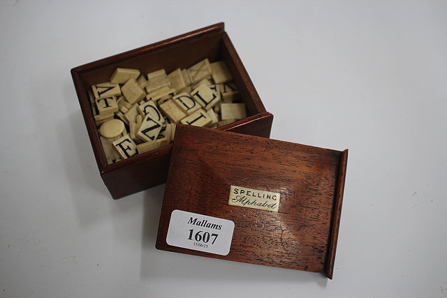 Appraisal: A VICTORIAN MAHOGANY CASED SET OF BONE ALPHABET LETTERS the