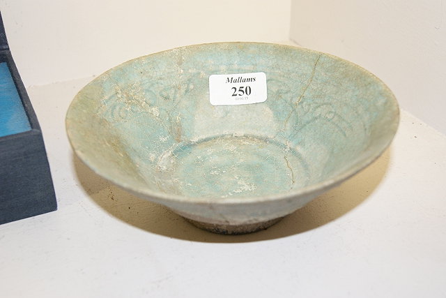 Appraisal: Iznik turquoise ground tapering bowl th th Century with iridescent