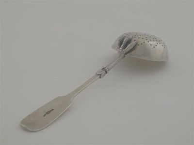 Appraisal: A late th century Russian sugar sifter ladle the lower