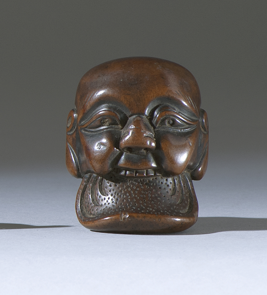 Appraisal: WOOD MASK NETSUKE Early th CenturyIn the form of a