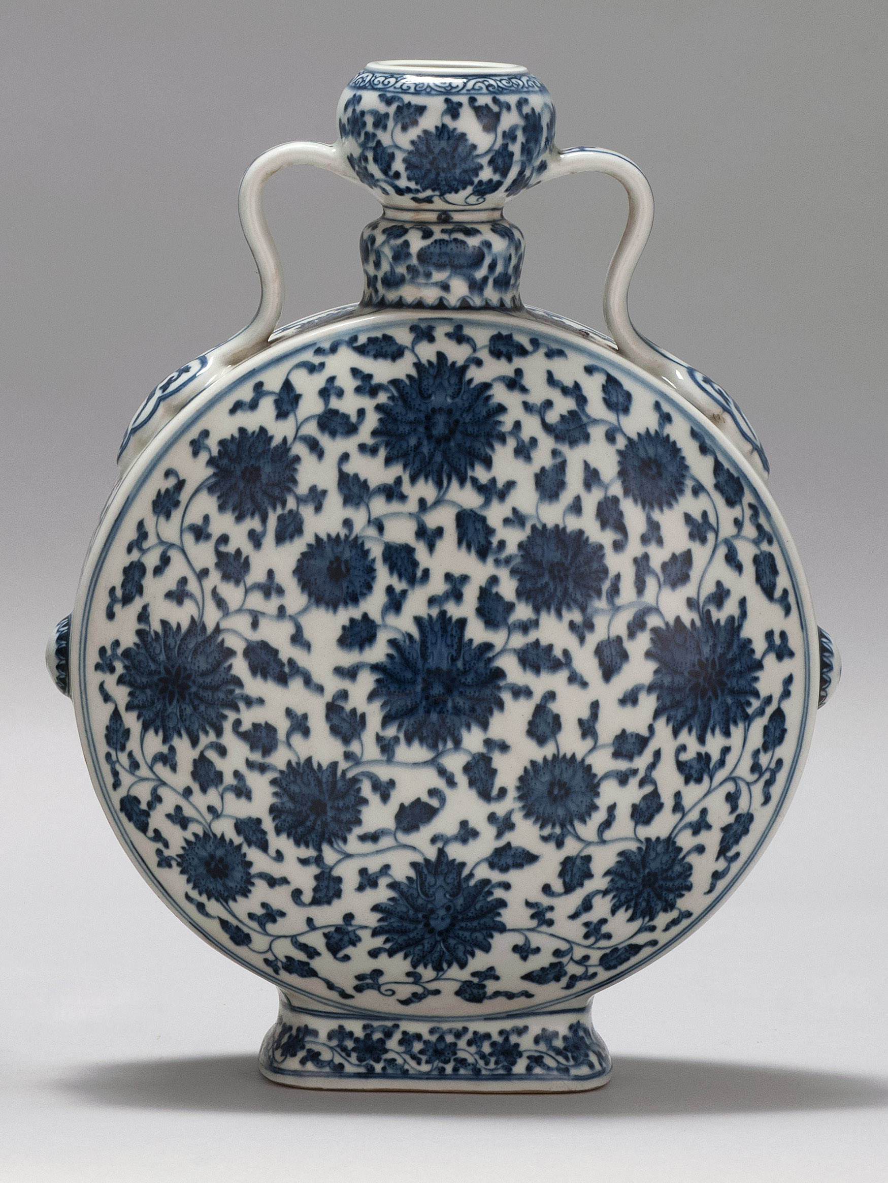 Appraisal: BLUE AND WHITE PORCELAIN MOON FLASK th CenturyIn passionflower design