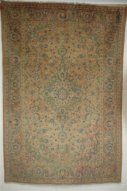 Appraisal: A KASHAN PINK GROUND RUG with central medallion decoration within