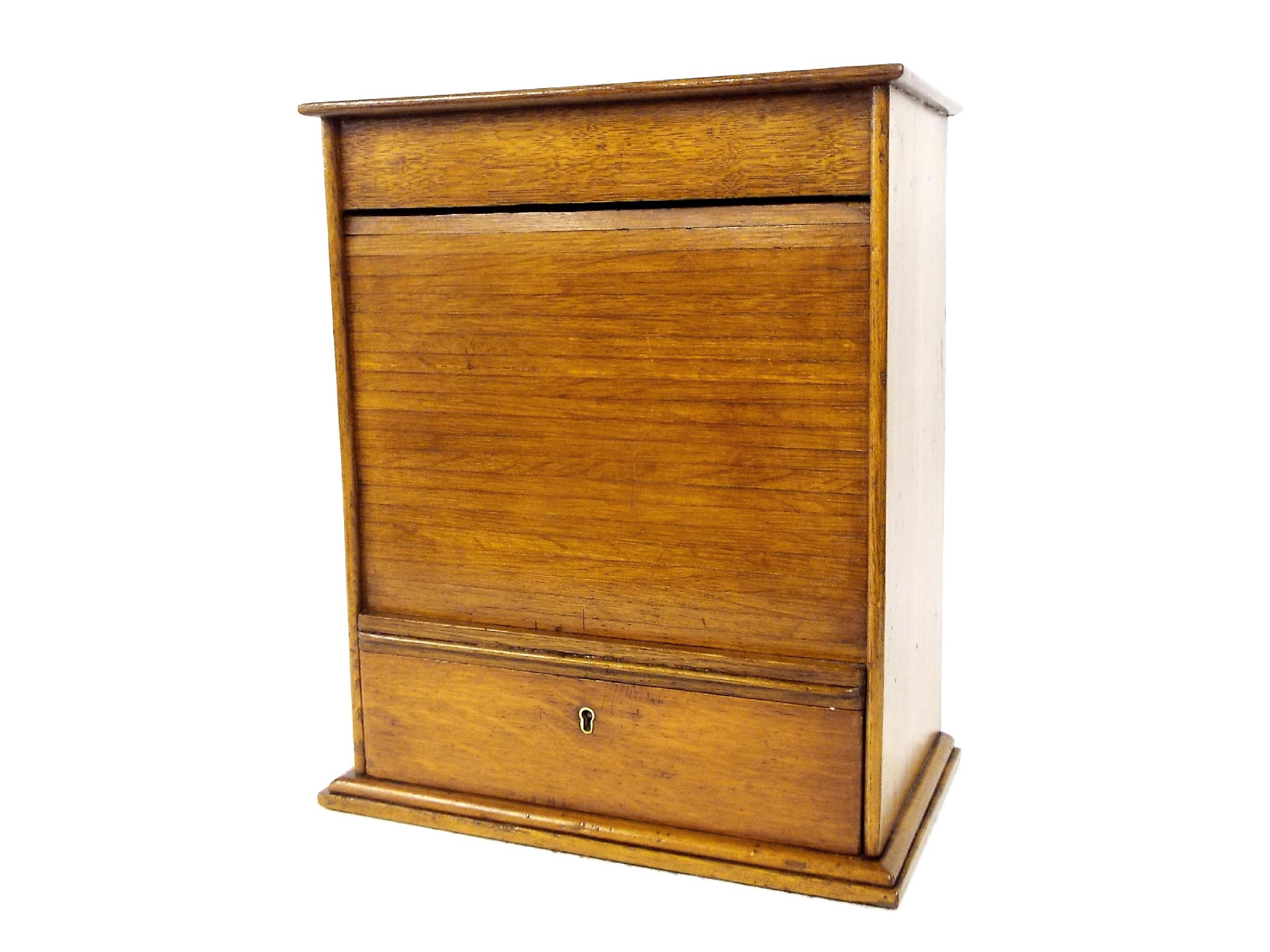 Appraisal: Golden oak table stationery cabinet the tambour front enclosing a