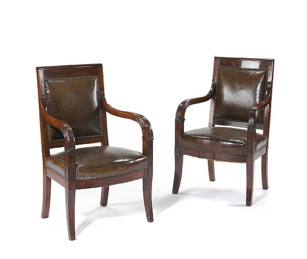 Appraisal: A pair of Empire mahogany and leather upholstered fauteuils Orleansfirst