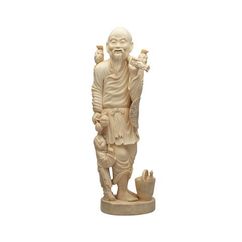 Appraisal: Large Ivory Carved Figure of a Farmer and Boy Circa