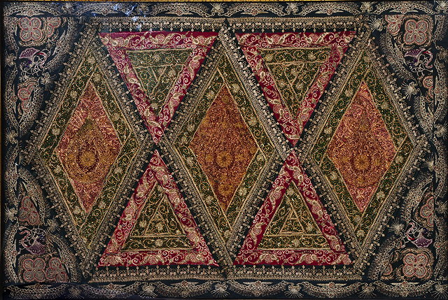 Appraisal: A LARGE INDIAN EMBROIDERED NEEDLEWORK PANEL with geometric designs worked