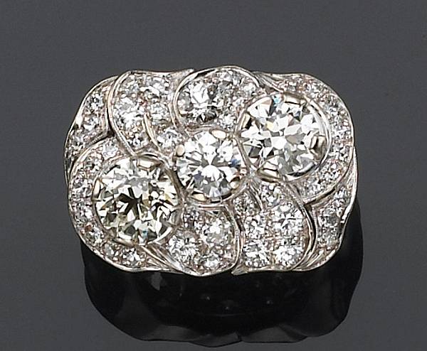 Appraisal: A diamond and fourteen karat white gold ring in plaque