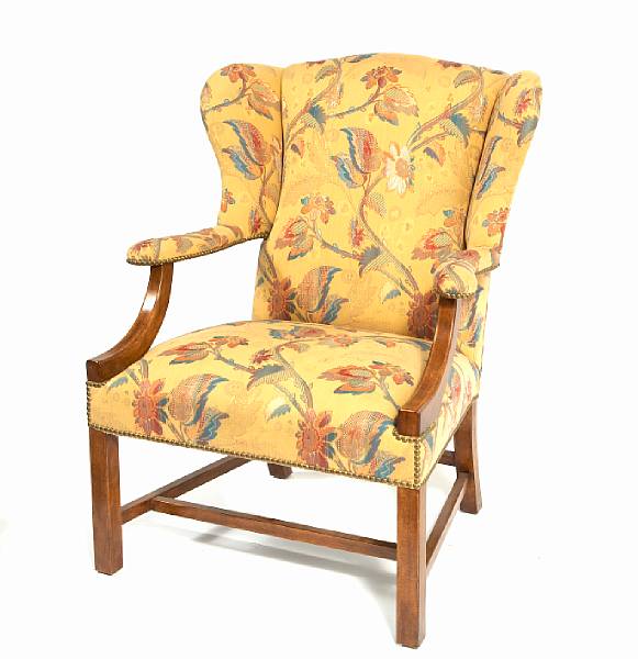 Appraisal: A George III style wing back armchair height in width