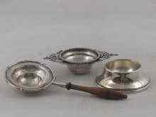 Appraisal: A silver two handled tea strainer hallmarked for Sheffield together