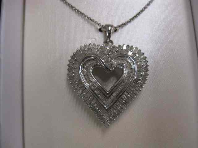 Appraisal: Diamond Heart Pendant carat of round baguette diamonds in sterling