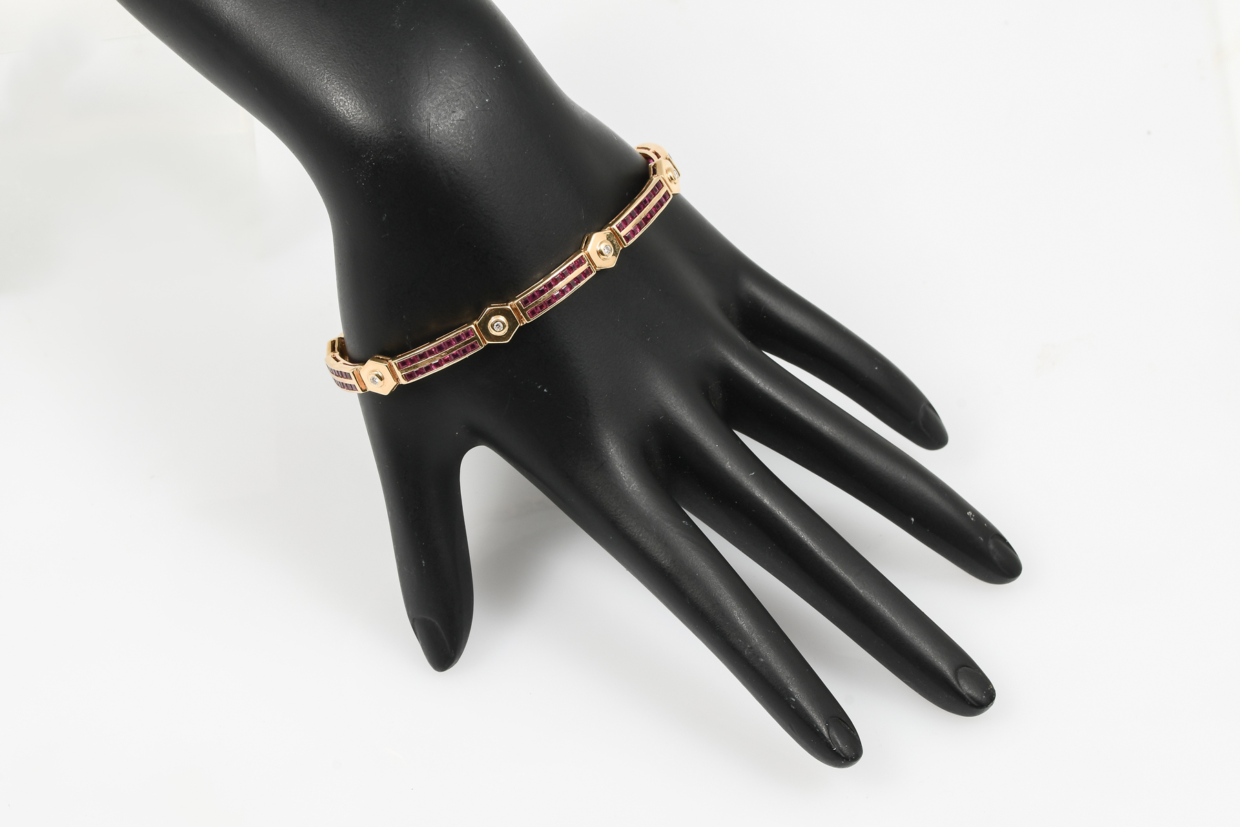 Appraisal: K DIAMOND RUBY BRACELET K yellow gold links are each