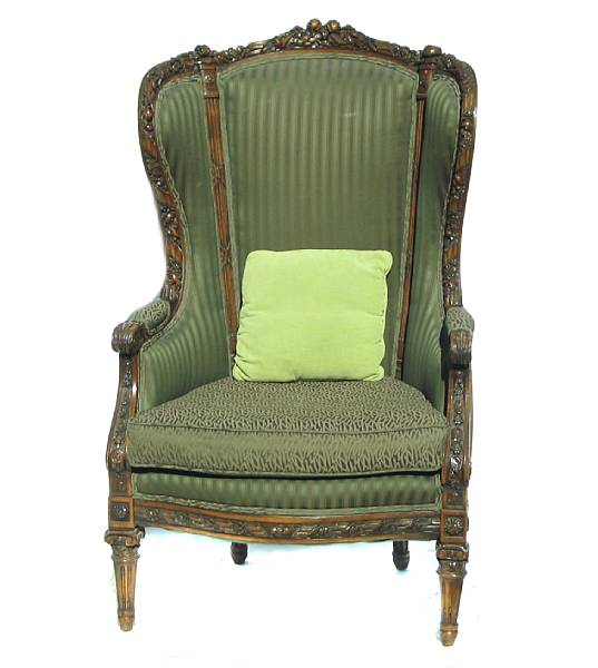 Appraisal: A Louis XVI style walnut bergere a oreilles th century