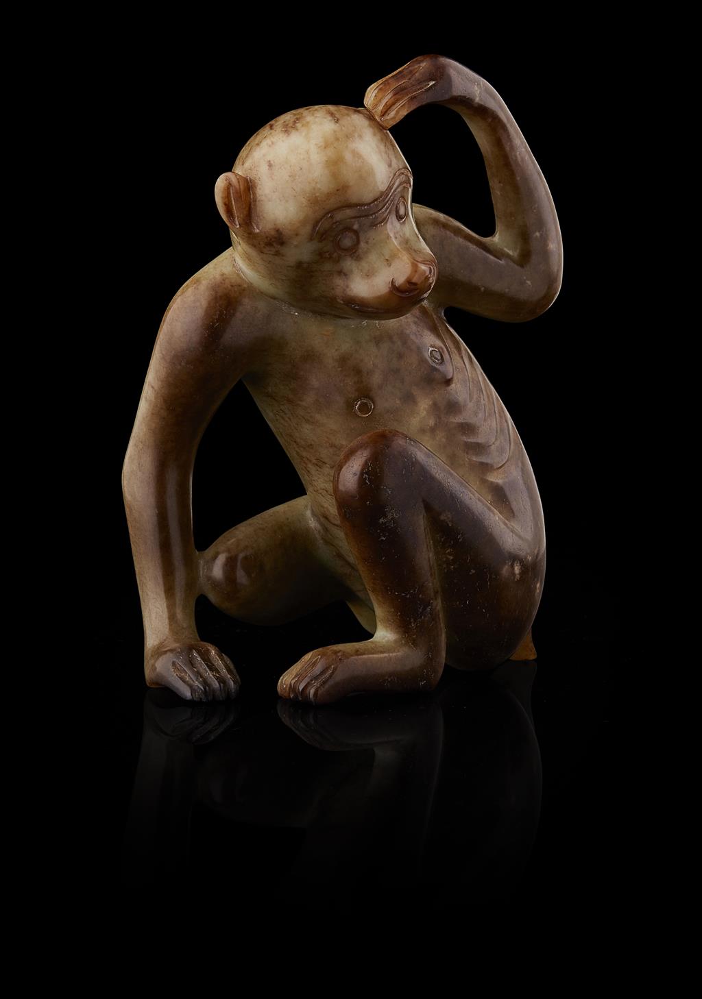 Appraisal: CELADON AND RUSSET JADE MONKEY carved in a crouched position