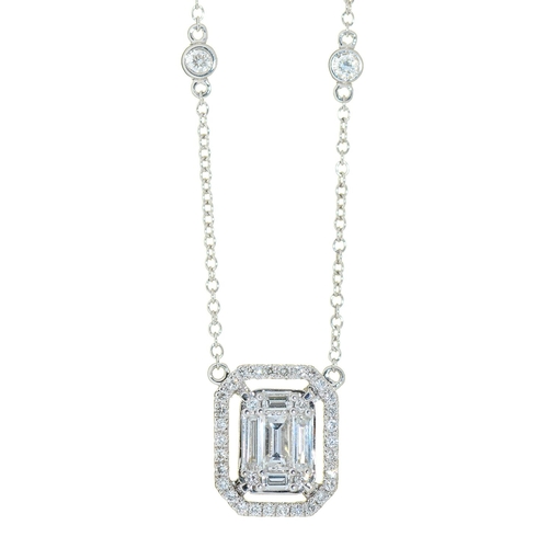 Appraisal: A diamond pendant with central cluster of emerald cut and