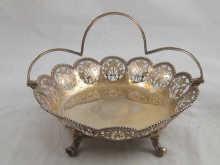 Appraisal: A late Victorian silver swing handle basket on four feet