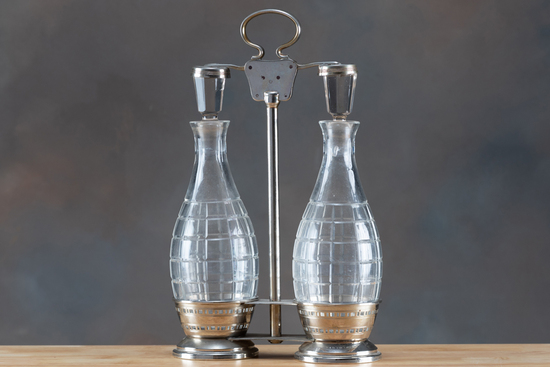 Appraisal: Silver and crystal Tantalus bottles have ground stoppers and measures