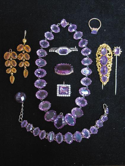 Appraisal: AN AMETHYST-SET DEMI PARURE comprising a graduated cushion-cut amethyst necklace