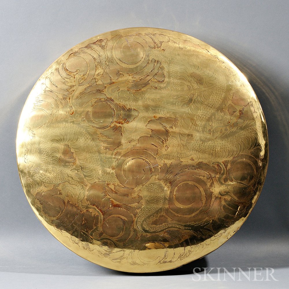 Appraisal: Brass Gong China decorated with a coiled dragon and pearls