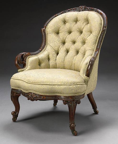 Appraisal: A Victorian carved rosewood armchair late th century The shaped