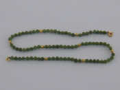 Appraisal: A yellow metal tests carat gold and nephrite bead necklace