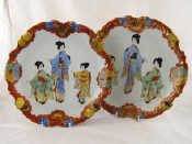 Appraisal: A pair of Japanese ceramic plates decorated with three maidens