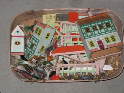 Appraisal: A Continental toy village in painted wood with six buildings