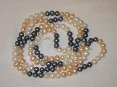 Appraisal: A MULTI COLOURED FRESH WATER PEARL NECKLACE comprising sections of