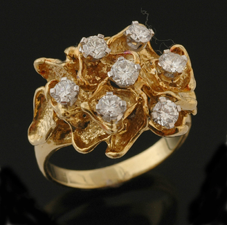 Appraisal: An abstract style diamond cluster ring The ct gold ring