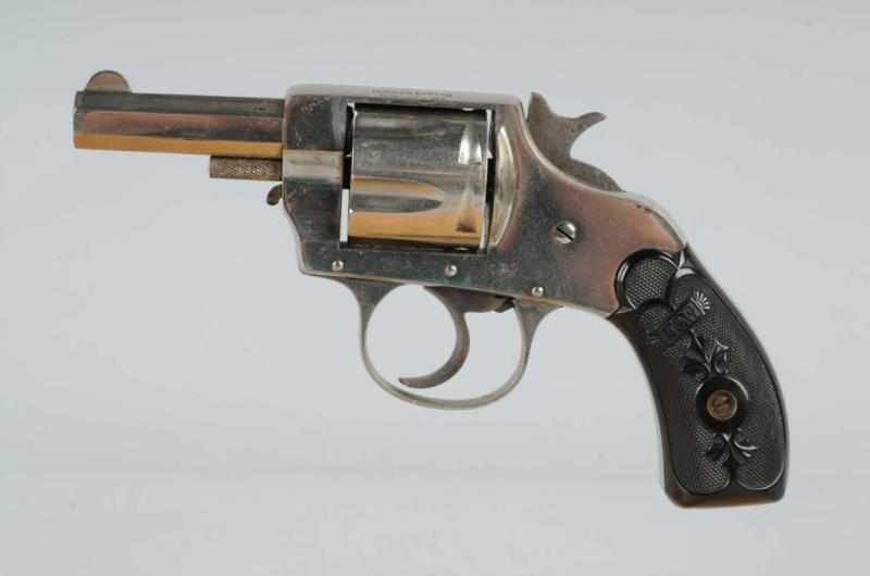 Appraisal: F W Double Action Revolver w Leather Holster Description cal