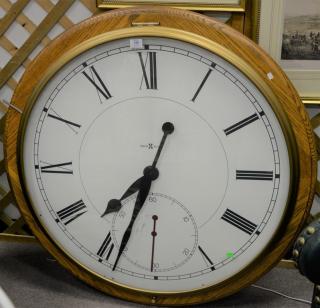 Appraisal: Large Howard Miller round clock dia in Large Howard Miller