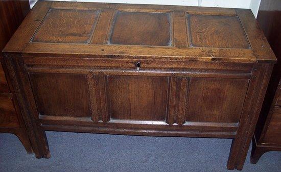 Appraisal: An th Century oak chest with triple panelled front and