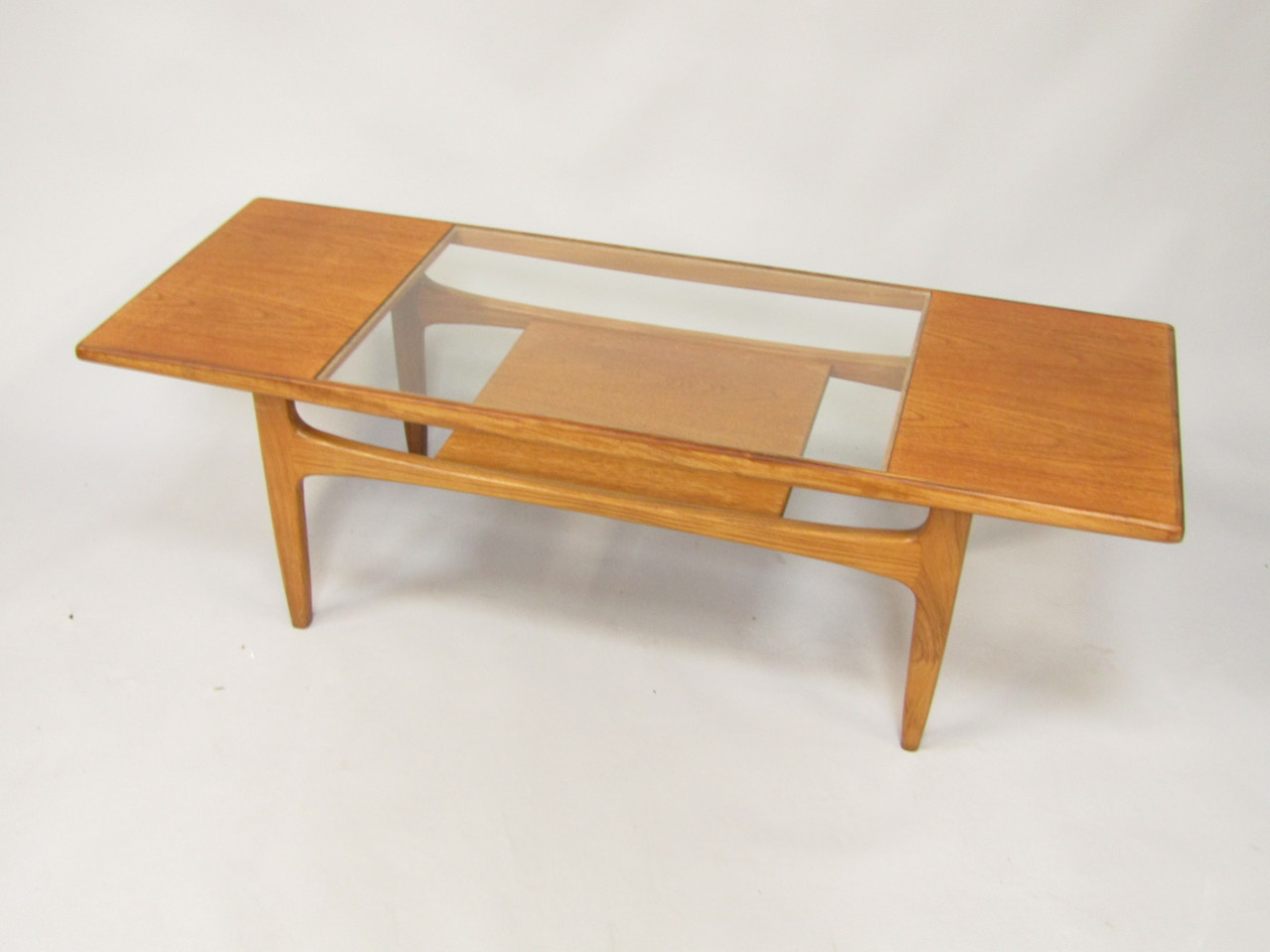 Appraisal: A G-Plan teak retro style coffee table the rectangular top