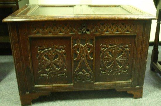 Appraisal: An oak chest the hinged double panel lid above a