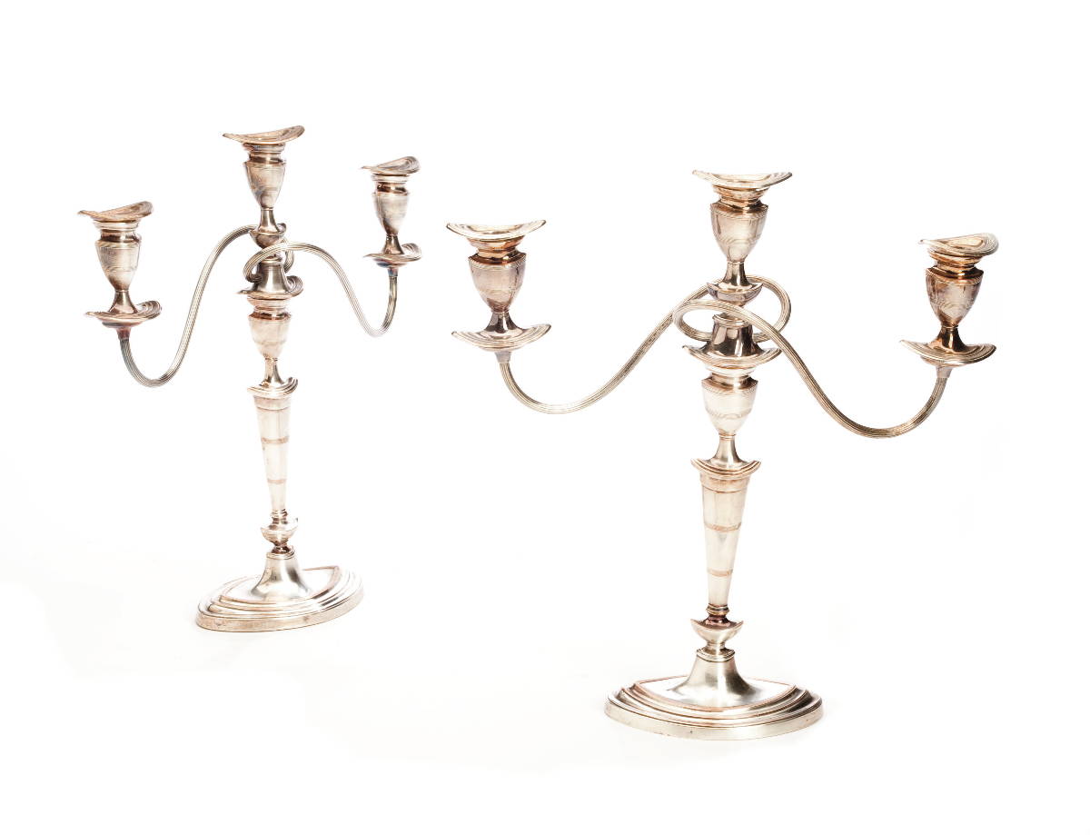 Appraisal: PAIR OF SHEFFIELD PLATE THREE-LIGHT CANDELABRA NINETEENTH CENTURY Each of