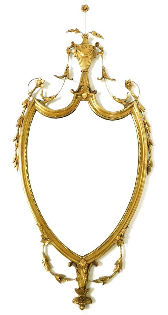 Appraisal: Georgian-style wall mirror with urn pediment over shield ornate gilt