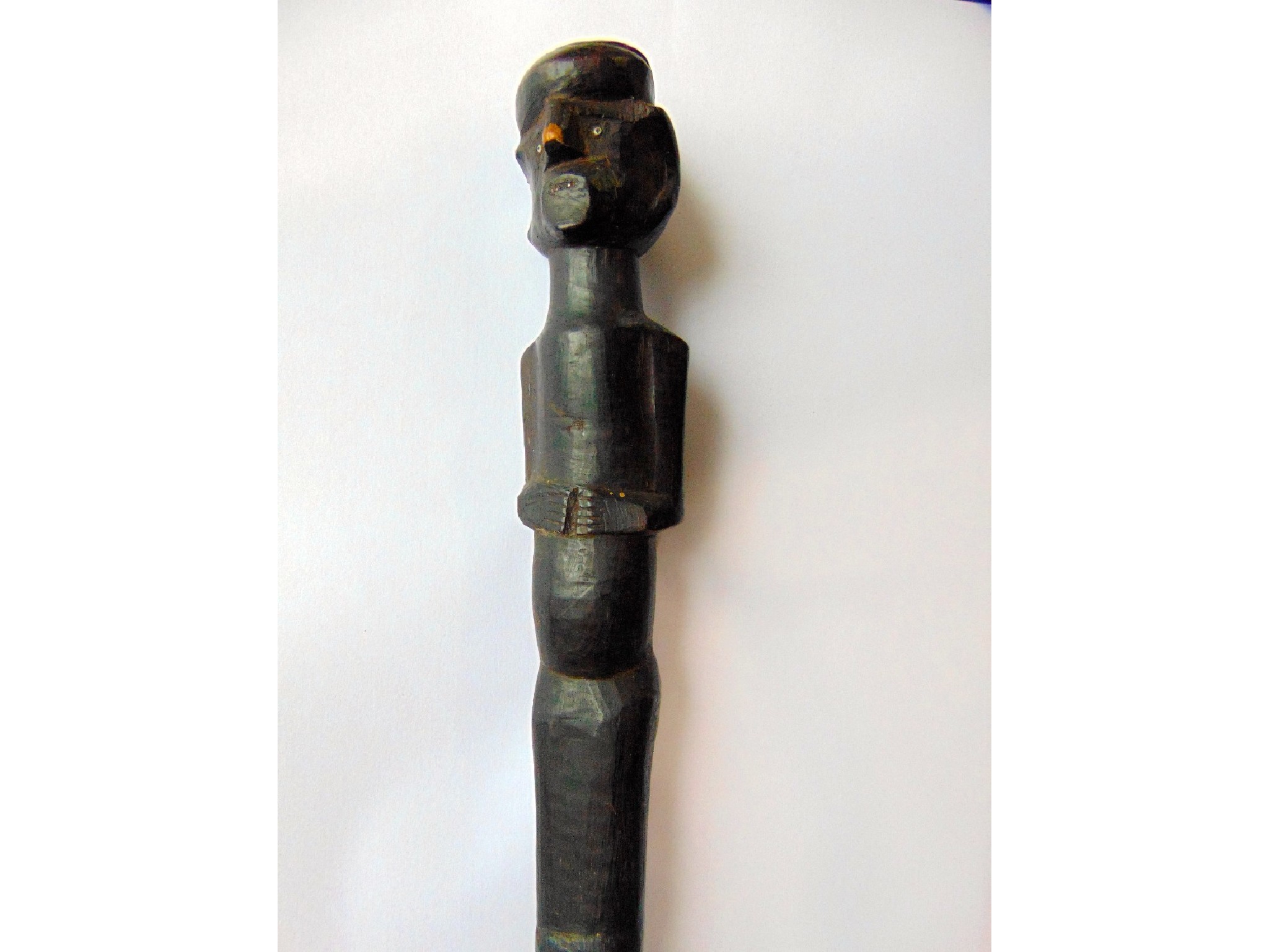 Appraisal: An old African stained timber staff terminating in a stylised